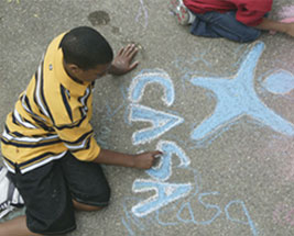 Child Writing With Chalk